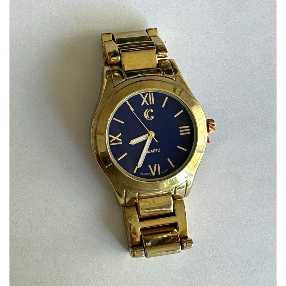 Charming Charlie Women's Gold Tone Bracelet Wristwatch Blue Dial Roman Numerals